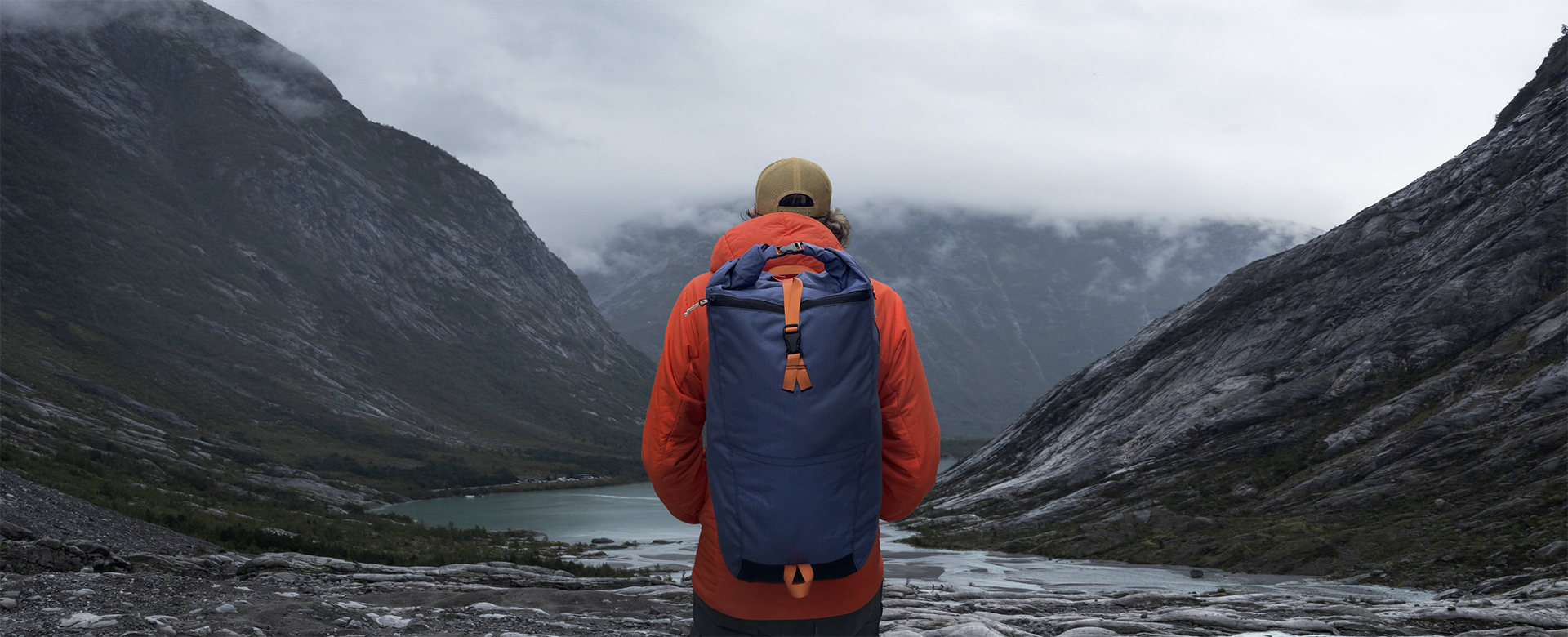 A man has on a fully recyclable backpack coated with PolyCores ReCirX². 